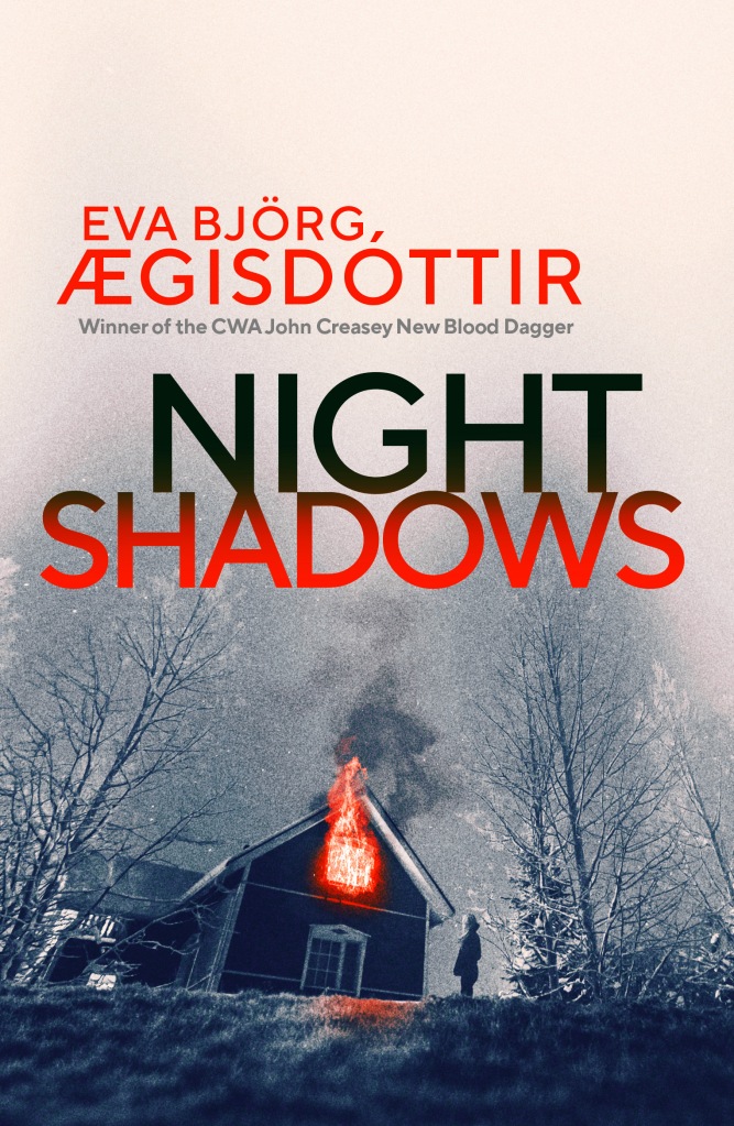 Image Description: The cover of Night Shadows features the image of a house on fire. A figure stares at the flames.